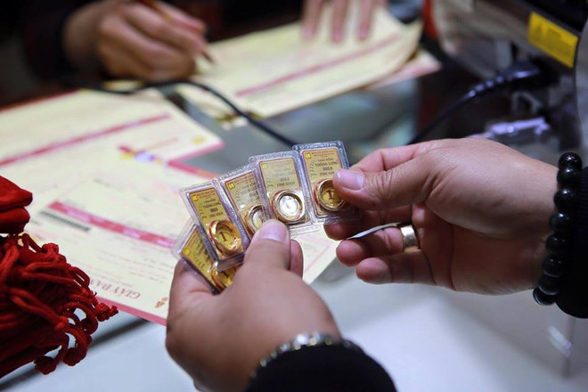 Giá vàng trong nước bật tăng, tỷ giá trung tâm giảm thêm 1 đồng ảnh 1