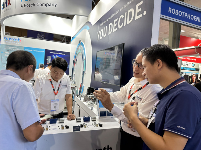 Kết nối doanh nghiệp tham gia chuỗi cung ứng. (Ảnh: Đức Duy/Vietnam+) Công nghiệp hỗ trợ: Tạo lực đẩy để doanh nghiệp kết nối chuỗi cung ứng ảnh 1