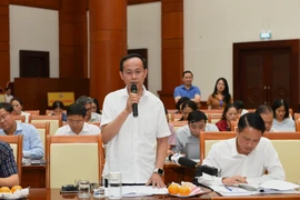 Ông Lưu Đức Huy cung cấp thông tin chi tiết về tiến độ nghiên cứu và hoàn thiện các chính sách thuế. (Ảnh: Vietnam+)