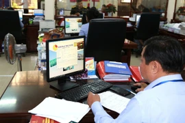 Kho bạc Nhà nước quán triệt, chỉ đạo thực hiện chi trả chính sách, chế độ đối với người nghỉ việc theo Nghị định số 178/2025/NĐ-CP. (Ảnh: Vietnam+)