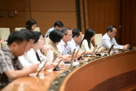 Các đại biểu đánh giá cao những nỗ lực của Ngân hàng Chính sách Xã hội trong suốt chặng đường phát triển hơn 22 năm. (Ảnh: CTV/Vietnam+)