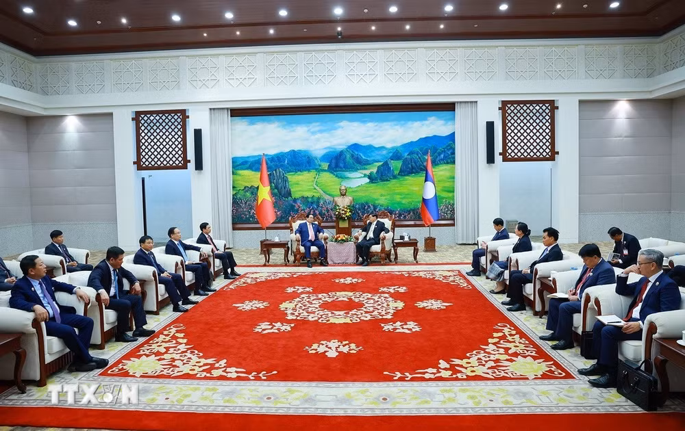 ttxvn-0312-thu-tuong-hoi-kien-tong-bi-thu-chu-tich-nuoc-lao-4.jpg