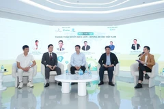 Hội thảo với chủ đề "Thanh toán xuyên biên giới: Xu hướng toàn cầu và giải pháp cho Việt Nam" được tổ chức tại Hà Nội. (Ảnh: PV/Vietnam+)