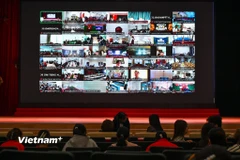 Lớp tập huấn diễn ra theo hình thức trực tiếp tại điểm cầu chính (Hội trường Học viện Công nghệ Bưu chính Viễn thông) và 200 điểm cầu trực tuyến với hơn 2.000 học viên tham dự. (Ảnh: Minh Sơn/Vietnam+)