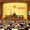 Quốc hội biểu quyết thông qua Luật Thương mại điện tử. (Ảnh: Doãn Tấn/TTXVN)