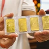 Giá vàng trong nước tiếp tục tăng mạnh theo giá vàng thế giới. (Ảnh: Vietnam+)