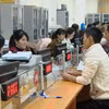 Người lao động tại Thanh Hóa đến Trung tâm dịch vụ việc làm để tư vấn về các chinh sách hỗ trợ việc làm, đi làm việc ở nước ngoài. (Ảnh: PV/Vietnam+)