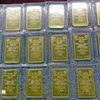 Giá vàng SJC của Công ty Vàng bạc đá quý Sài Gòn và Công ty Doji niêm yết từ 156,6-158,6 triệu đồng/lượng (mua vào/bán ra). (Ảnh: TTXVN)