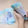 Việc điều chỉnh mức lương cơ sở không chỉ mang ý nghĩa kỹ thuật mà còn là động lực làm việc và chất lượng đội ngũ cán bộ, công chức, viên chức. (Ảnh: PV/Vietnam+)