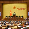 Quốc hội biểu quyết thông qua Luật sửa đổi, bổ sung một số điều của Luật Trợ giúp pháp lý. (Ảnh: Doãn Tấn/TTXVN)