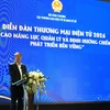 Ông Hoàng Ninh, Phó Cục trưởng Cục Thương mại điện tử và Kinh tế số phát biểu tại diễn đàn. (Ảnh: PV/Vietnam+)