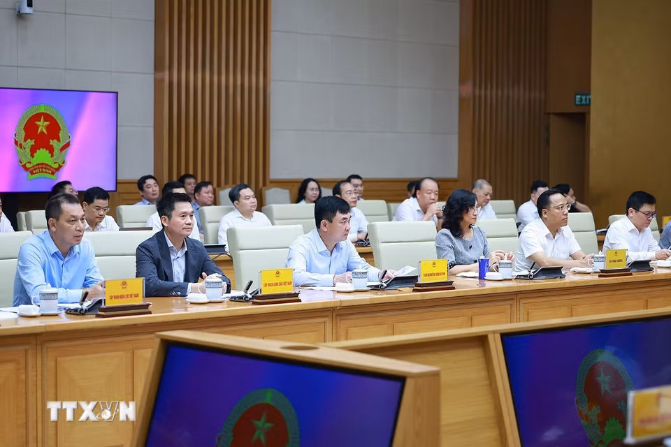Lãnh đạo Bộ Công Thương tham dự buổi làm việc. (Ảnh: Dương Giang/TTXVN) ​