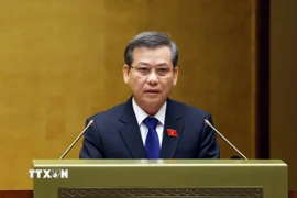 Chánh án Tòa án Nhân dân Tối cao Lê Minh Trí trình bày Báo cáo công tác nhiệm kỳ 2021-2026 của Tòa án Nhân dân Tối cao. (Ảnh: Phạm Kiên/TTXVN)