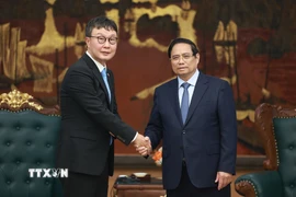 Thủ tướng Phạm Minh Chính tiếp ông Hyoung Nyon Kim, Phó Chủ tịch Tập đoàn Dunamu của Hàn Quốc. (Ảnh: Dương Giang/TTXVN)