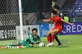 Thủ môn Cao Văn Bình U23 Việt Nam có pha cản phá cứu thua xuất sắc. (Nguồn AFC/TTXVN)