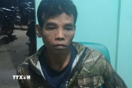 Đối tượng Điểu Trung bị bắt. (Ảnh: TTXVN phát)