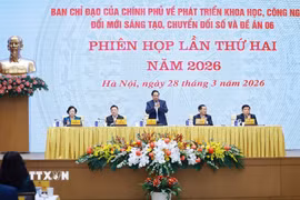 Thứ trưởng Bộ Công an Nguyễn Văn Long báo cáo kết quả triển khai Đề án 06. (Ảnh: Dương Giang/TTXVN)