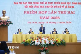 Thứ trưởng Bộ Công an Nguyễn Văn Long báo cáo kết quả triển khai Đề án 06. (Ảnh: Dương Giang/TTXVN)