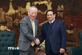 Thủ tướng Phạm Minh Chính tiếp ông Nghiêm Giới Hòa, người sáng lập Tập đoàn xây dựng Thái Bình Dương (Trung Quốc). (Ảnh: Dương Giang/TTXVN)