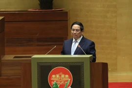 Thủ tướng Chính phủ trình bày Báo cáo đánh giá bổ sung kết quả thực hiện kế hoạch phát triển kinh tế-xã hội và ngân sách nhà nước năm 2024; tình hình thực hiện kế hoạch phát triển kinh tế-xã hội và ngân sách nhà nước những tháng đầu năm 2025. (Ảnh: TTXVN)