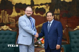 Thủ tướng Phạm Minh Chính tiếp ông Cristiano Amon, Chủ tịch kiêm Tổng giám đốc Tập đoàn Qualcomm của Hoa Kỳ. (Ảnh: Dương Giang/TTXVN)