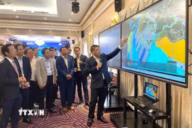 Ông Lê Văn Danh, Phó Giám đốc Sở Công Thương Thành phố Hồ Chí Minh giới thiệu về Khu FTZ Cái Mép Hạ tại Thành phố Hồ Chí Minh. (Ảnh: Hương Giang/TTXVN)