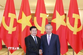 Tổng Bí thư Tô Lâm và Tổng Bí thư, Chủ tịch nước Lào Thongloun Sisoulith. (Ảnh: Thống Nhất/TTXVN)