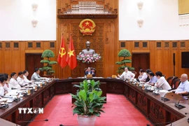 Thủ tướng Phạm Minh Chính chủ trì cuộc họp về tình hình triển khai tuyến đường sắt trọng điểm. (Ảnh: Dương Giang/TTXVN)