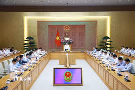 Thủ tướng Lê Minh Hưng chủ trì buổi làm việc với lãnh đạo Bộ Công Thương và các bộ, ngành về tháo gỡ khó khăn, thúc đẩy sản xuất kinh doanh. (Ảnh: Dương Giang/TTXVN)