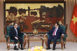 Thủ tướng Phạm Minh Chính tiếp ông Phoxay Sayasone, Bộ trưởng Bộ Lao động và Phúc lợi xã hội Lào. (Ảnh: Dương Giang/TTXVN)