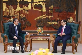 Thủ tướng Phạm Minh Chính tiếp ông Phoxay Sayasone, Bộ trưởng Bộ Lao động và Phúc lợi xã hội Lào. (Ảnh: Dương Giang/TTXVN)