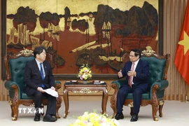 Thủ tướng Phạm Minh Chính và ông Hayashi Yoshimasa, Bộ trưởng Nội vụ và Truyền thông Nhật Bản. (Ảnh: Dương Giang/TTXVN)