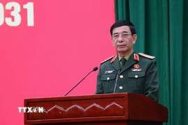 Đại tướng Phan Văn Giang, Bộ trưởng Quốc phòng, trình bày chương trình hành động. (Ảnh: Trần Trang/TTXVN)