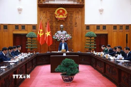 Thủ tướng Phạm Minh Chính chủ trì cuộc họp với lãnh đạo tỉnh Quảng Trị về xây dựng nhà ở cho các gia đình bị thiệt hại do thiên tai tại Quảng Trị. (Ảnh: Dương Giang/TTXVN)