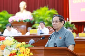 Thủ tướng Phạm Minh Chính phát biểu tại hội nghị tiếp xúc cử tri thành phố Cần Thơ chuyên đề về y tế và giáo dục. (Ảnh: Dương Giang/TTXVN)