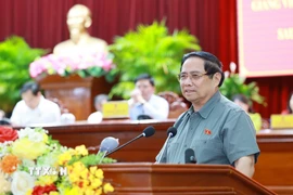 Thủ tướng Phạm Minh Chính phát biểu tại hội nghị tiếp xúc cử tri thành phố Cần Thơ chuyên đề về y tế và giáo dục. (Ảnh: Dương Giang/TTXVN)