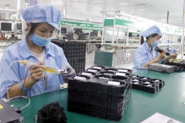 Công nhân tại một doanh nghiệp ở Bắc Giang. (Ảnh: Đồng Thúy/TTXVN)