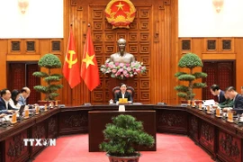 Phó Thủ tướng Hồ Quốc Dũng chủ trì cuộc họp với các bộ, ngành để cho ý kiến hoàn thiện về dự thảo Quyết định của Thủ tướng Chính phủ. (Ảnh: Xuân Tùng/TTXVN)