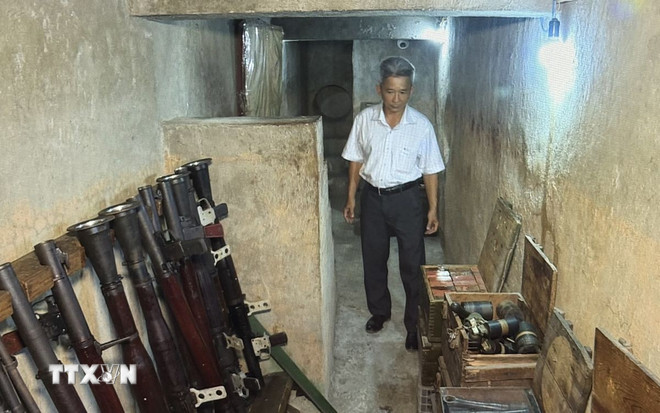 Căn hầm từng chứa hơn 2 tấn vũ khí các loại, bao gồm: lựu đạn, thuốc nổ, súng AK, súng B40... (Ảnh: Hữu Duyên/TTXVN) ttxvn-ham-chua-vu-khi-cua-biet-dong-sai-gon-2.jpg