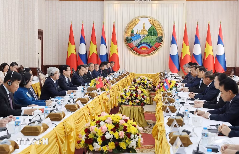 ttxvn-chu-tich-nuoc-luong-cuong-hoi-kien-thu-tuong-chinh-phu-lao-sonexay-siphandone-7995083.jpg