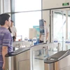Cảng hàng không Quốc tế Nội Bài chính thức triển khai làm thủ tục bay bằng sinh trắc học trên VNeID. (Ảnh: PV/Vietnam+)