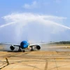 Chuyến bay đầu tiên của Vietnam Airlines khai trương Nhà ga T3 Tân Sơn Nhất đi vào hoạt động. (Ảnh: PV/Vietnam+)