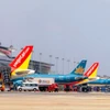 Máy bay của các hãng hàng không Việt Nam tại Cảng hàng không Quốc tế Nội Bài. (Ảnh: PV/Vietnam+)