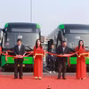 Lãnh đạo Ủy ban Nhân dân thành phố Hà Nội cắt băng khai trương 3 tuyến buýt điện của Tổng công ty Vận tải Hà Nội. (Ảnh: Hoài Nam/Vietnam+)