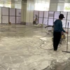 Nhà thầu huy động nhân lực và máy móc để hoàn thiện nền đá của Nhà ga T3-Tân Sơn Nhất. (Ảnh: PV/Vietnam+)