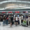 Hành khách tại sân bay Tân Sơn Nhất. (Ảnh: PV/Vietnam+)