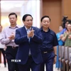 Thủ tướng Phạm Minh Chính đến dự và phát động thi đua chào mừng Đại hội XIV của Đảng. (Ảnh: Dương Giang/TTXVN)