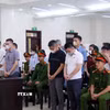 Các bị cáo tại phiên tòa xét xử. (Ảnh: Phạm Kiên/TTXVN)