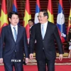 Chủ tịch nước Lương Cường hội kiến Thủ tướng Chính phủ Lào Sonexay Siphandone. (Ảnh: Lâm Khánh/TTXVN)