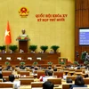 Quốc hội biểu quyết thông qua Luật sửa đổi, bổ sung một số điều Luật Kinh doanh bảo hiểm. (Ảnh: Doãn Tấn/TTXVN)
